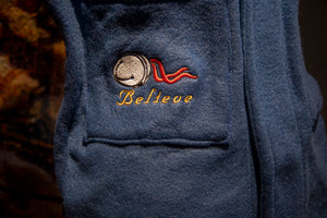 The Polar Express robe. The words "The Polar Express" are embroidered on upper left while the right bottom pocket features a bell design and "Believe" bell embroidery